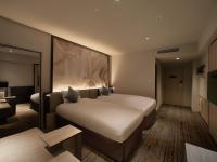 ORIENTAL HOTEL UNIVERSAL CITY客房内的一张或多张床位