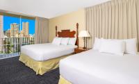 Ohia Waikiki Studio Suites客房内的一张或多张床位