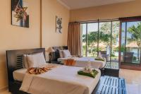 Ocean View Tulamben Dive &amp; Resort客房内的一张或多张床位