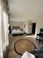 Hôtel l'Arena客房内的一张或多张床位