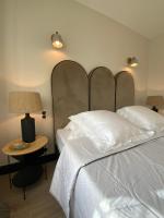 Hôtel l'Arena客房内的一张或多张床位
