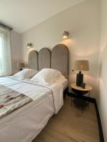 Hôtel l'Arena客房内的一张或多张床位