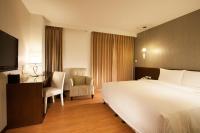 Ramada Encore By Wyndham Hualien客房内的一张或多张床位
