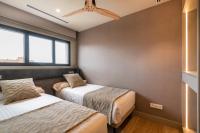 Apartamentos Core Suites Valencia客房内的一张或多张床位