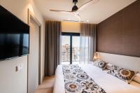 Apartamentos Core Suites Valencia客房内的一张或多张床位
