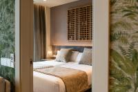 Apartamentos Core Suites Valencia客房内的一张或多张床位