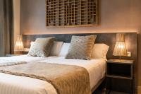 Apartamentos Core Suites Valencia客房内的一张或多张床位