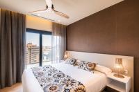 Apartamentos Core Suites Valencia客房内的一张或多张床位