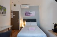 Hotel l'Hotera客房内的一张或多张床位