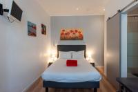 Hotel l'Hotera客房内的一张或多张床位