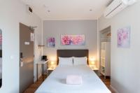 Hotel l'Hotera客房内的一张或多张床位