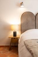 Hôtel l'Arena客房内的一张或多张床位
