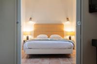 Hôtel l'Arena客房内的一张或多张床位