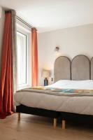 Hôtel l'Arena客房内的一张或多张床位