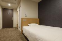 Plum Hotel客房内的一张或多张床位