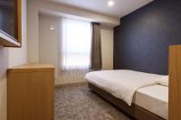 Plum Hotel客房内的一张或多张床位