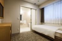 Plum Hotel客房内的一张或多张床位
