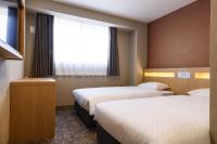 Plum Hotel客房内的一张或多张床位