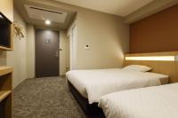 Plum Hotel客房内的一张或多张床位
