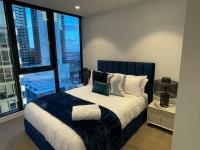 Modern 3 Bedroom Apartment in Southbank客房内的一张或多张床位