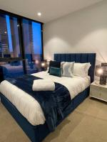 Modern 3 Bedroom Apartment in Southbank客房内的一张或多张床位