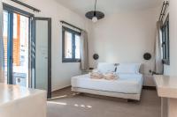 North Wind Luxury Suites客房内的一张或多张床位