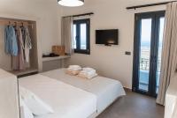 North Wind Luxury Suites客房内的一张或多张床位