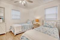 Lovely Beach Bungalow客房内的一张或多张床位