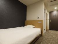 Plum Hotel客房内的一张或多张床位
