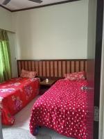 zous homestay客房内的一张或多张床位
