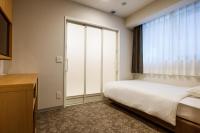 Plum Hotel客房内的一张或多张床位