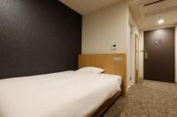 Plum Hotel客房内的一张或多张床位