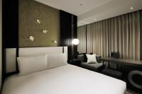 KOKO HOTEL Premier Kumamoto客房内的一张或多张床位