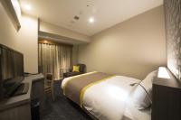 Almont Inn Tokyo Nihonbashi客房内的一张或多张床位