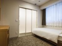 Plum Hotel客房内的一张或多张床位