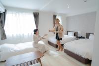 Cozy Inn OTARU客房内的一张或多张床位