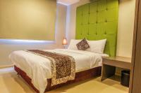 The Exchange Regency Residence Hotel Managed by HII客房内的一张或多张床位