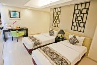 The Exchange Regency Residence Hotel Managed by HII客房内的一张或多张床位