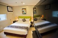 The Exchange Regency Residence Hotel Managed by HII客房内的一张或多张床位