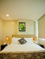 The Exchange Regency Residence Hotel Managed by HII客房内的一张或多张床位