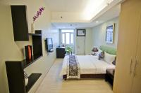 The Exchange Regency Residence Hotel Managed by HII客房内的一张或多张床位