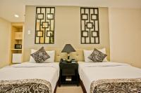 The Exchange Regency Residence Hotel Managed by HII客房内的一张或多张床位