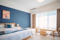 谷町君 HOTEL 恵美須町72客房内的一张或多张床位