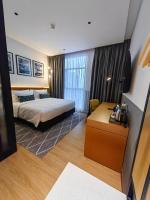 Citadines Connect Georgetown Penang客房内的一张或多张床位