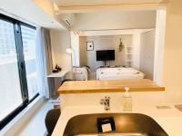 FLOWER TERRACE Higashi Shinjuku客房内的一张或多张床位