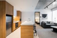 Nesuto Docklands客房内的一张或多张床位