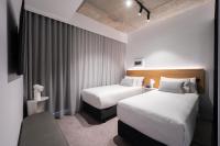 Nesuto Docklands客房内的一张或多张床位