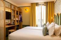 Hôtel Jardin de Cluny客房内的一张或多张床位