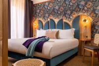 Hôtel Jardin de Cluny客房内的一张或多张床位