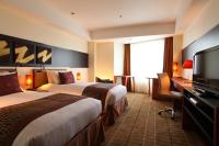 International Resort Hotel Yurakujo客房内的一张或多张床位